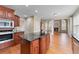 Open floor plan kitchen with a large island, breakfast bar, and view into the living room at 3413 Talking Creek Ct, Conyers, GA 30094