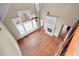 Open-concept living room boasting a fireplace, hardwood floors, large windows, and access to other rooms at 3413 Talking Creek Ct, Conyers, GA 30094