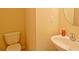 Small bathroom with toilet and pedestal sink at 2024 Appaloosa Way, Conyers, GA 30012