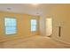 Spacious bedroom with neutral carpet and two windows at 2024 Appaloosa Way, Conyers, GA 30012