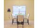 Dining area with glass table and four chairs at 2024 Appaloosa Way, Conyers, GA 30012