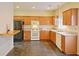 Kitchen with wood cabinets and dark floor tile at 2024 Appaloosa Way, Conyers, GA 30012