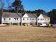 Row of townhouses with gray roofs, brick exteriors, and attached garages at 4521 Twinberry Dr, Powder Springs, GA 30127