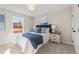 Bedroom with blue bedding and window overlooking yard at 4521 Twinberry Dr, Powder Springs, GA 30127