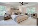 Main bedroom with plush carpeting, large windows, and a neutral color palette at 4521 Twinberry Dr, Powder Springs, GA 30127