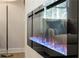 Modern electric fireplace with blue crystal accents at 4521 Twinberry Dr, Powder Springs, GA 30127