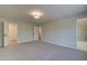 Spacious main bedroom with carpet and access to bathroom at 4521 Twinberry Dr, Powder Springs, GA 30127