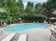 Community pool with lounge chairs at 4521 Twinberry Dr, Powder Springs, GA 30127