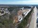 Aerial view of new construction site along highway with trees and some snow on ground at 4529 Twinberry Dr, Powder Springs, GA 30127