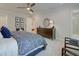 Spacious bedroom with dresser, seating area, and ensuite bathroom at 4529 Twinberry Dr, Powder Springs, GA 30127