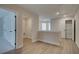 Hallway with wood-look flooring, neutral paint, closet with shelving, and multiple doorways at 4529 Twinberry Dr, Powder Springs, GA 30127