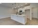 Bright kitchen with a center island, quartz countertops, stainless steel appliances, and modern pendant lights at 4529 Twinberry Dr, Powder Springs, GA 30127