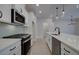 Modern kitchen with stainless steel appliances and white cabinets at 4529 Twinberry Dr, Powder Springs, GA 30127