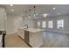 Modern kitchen, white cabinets, quartz countertops, island with seating at 4529 Twinberry Dr, Powder Springs, GA 30127