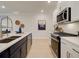 Modern kitchen with stainless steel appliances and island at 4529 Twinberry Dr, Powder Springs, GA 30127