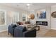 Inviting living room featuring a modern fireplace, neutral tones, hardwood floors, and plenty of natural light at 4529 Twinberry Dr, Powder Springs, GA 30127