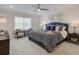 Main bedroom with sitting area and king-size bed at 4529 Twinberry Dr, Powder Springs, GA 30127