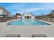 Community swimming pool with lounge chairs at 4529 Twinberry Dr, Powder Springs, GA 30127