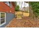 Backyard with wooden steps leading up to the house at 2216 Golden Dawn Sw Dr, Atlanta, GA 30311