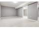 Unfinished basement area with tile flooring and neutral gray walls at 2216 Golden Dawn Sw Dr, Atlanta, GA 30311