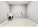 Basement featuring a sink, utility connection, neutral grey walls, and tile floors at 2216 Golden Dawn Sw Dr, Atlanta, GA 30311