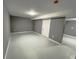 Spacious finished basement area with neutral paint and gray-tiled flooring at 2216 Golden Dawn Sw Dr, Atlanta, GA 30311