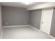 Finished basement room with grey walls and white trim at 2216 Golden Dawn Sw Dr, Atlanta, GA 30311