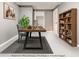 Staged basement office features a modern desk, bookshelf, and neutral walls at 2216 Golden Dawn Sw Dr, Atlanta, GA 30311