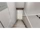 Basement staircase leading to a finished basement with neutral walls and white trim at 2216 Golden Dawn Sw Dr, Atlanta, GA 30311