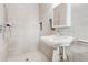 Modern bathroom featuring updated tiles, a sink, and shower at 2216 Golden Dawn Sw Dr, Atlanta, GA 30311