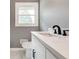 Bright bathroom featuring a white marble countertop, modern black hardware, and natural light at 2216 Golden Dawn Sw Dr, Atlanta, GA 30311