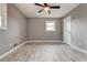 Bedroom featuring hardwood floors, neutral paint, closet, and a ceiling fan at 2216 Golden Dawn Sw Dr, Atlanta, GA 30311