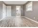 Bedroom featuring hardwood floors, new paint, closet, and natural light at 2216 Golden Dawn Sw Dr, Atlanta, GA 30311