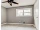 Well-lit bedroom features modern flooring, a ceiling fan and a large window for natural light at 2216 Golden Dawn Sw Dr, Atlanta, GA 30311