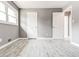 Cozy bedroom with wood-look flooring, light gray walls, and white trim, creating a peaceful atmosphere at 2216 Golden Dawn Sw Dr, Atlanta, GA 30311