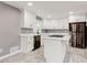 Bright kitchen features white cabinetry, an island cooktop, quartz countertops, and stainless steel appliances at 2216 Golden Dawn Sw Dr, Atlanta, GA 30311