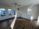 Living room with wood flooring, neutral walls, ceiling fan and access to an outdoor balcony at 508 Zeal Se St # 292, Atlanta, GA 30315