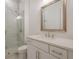 Bathroom featuring a marble tile shower, quartz countertop, and white cabinets at 104 Ivey Way, Woodstock, GA 30188