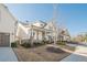 Attractive house with brick accents, and manicured landscaping provides a welcoming sight at 104 Ivey Way, Woodstock, GA 30188