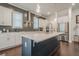 Spacious kitchen with center island, stainless steel refrigerator and stainless appliances at 104 Ivey Way, Woodstock, GA 30188