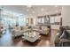 Spacious open living room and kitchen with modern furnishings and ample natural light at 104 Ivey Way, Woodstock, GA 30188