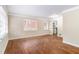 Bright living room featuring hardwood floors and large windows at 2053 Wells Sw Dr, Atlanta, GA 30311