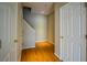 Hardwood floor hallway with access to stairs and storage at 308 Spring Heights Lane # 308, Smyrna, GA 30080