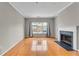 Living room with hardwood floors, fireplace and large window at 308 Spring Heights Ln # 308, Smyrna, GA 30080