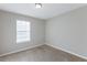 Sunny bedroom with carpeted floor and window at 5910 Rock Rd, Union City, GA 30291