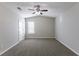 Bright bedroom featuring a ceiling fan and window at 5910 Rock Rd, Union City, GA 30291