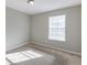 Well-lit bedroom with carpeted floor and window at 5910 Rock Rd, Union City, GA 30291