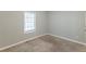 Well-lit bedroom with carpet and a window at 5910 Rock Rd, Union City, GA 30291