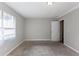 Bright bedroom featuring a window and carpet flooring at 5910 Rock Rd, Union City, GA 30291