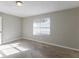 Spacious bedroom with neutral walls and carpet at 5910 Rock Rd, Union City, GA 30291